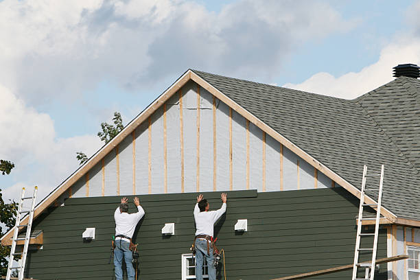 Professional Storm Damage Siding Repair technician working in Elizabethville, PA